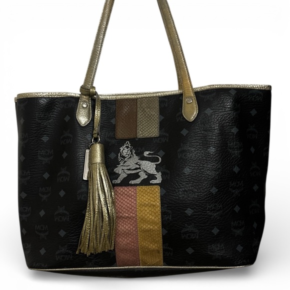 MCM Handbags - MCM Black Visetos Coated Canvas and Leather Princess Lion Shopper Tote.